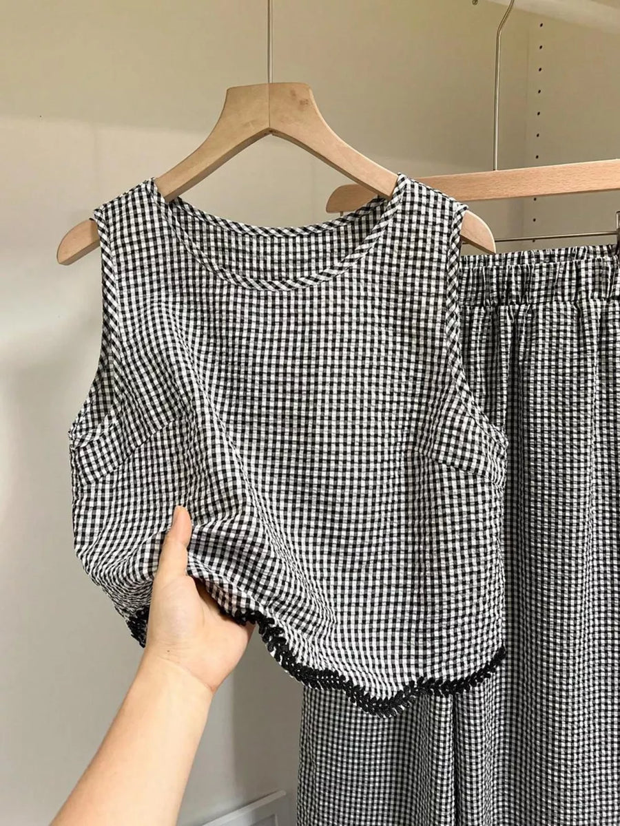 Plaid two-piece set with scalloped trim detail on sleeveless top and pants.