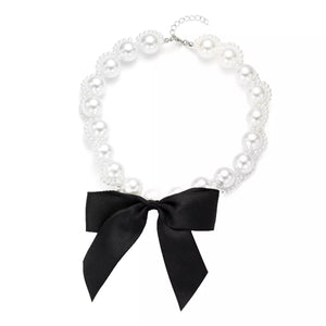 Pearl choker necklace with black bow detail