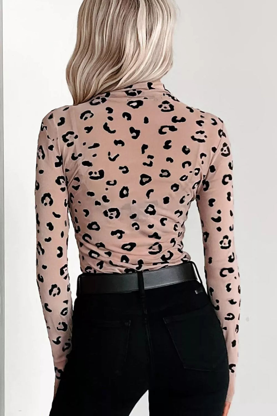 Sheer mesh bodysuit in khaki with black leopard print, long sleeves, and mock neck.