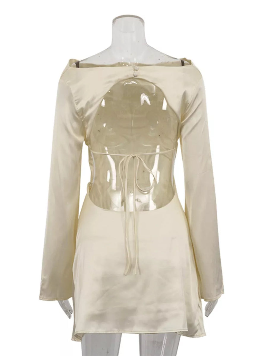 Cream satin long sleeve mini dress with open back and tie detail