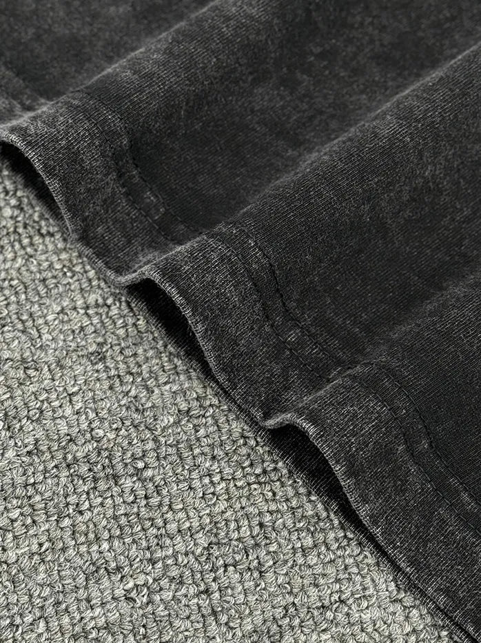 Acid wash oversized crew neck tee in Washed Black, showing fabric texture and stitching detail.