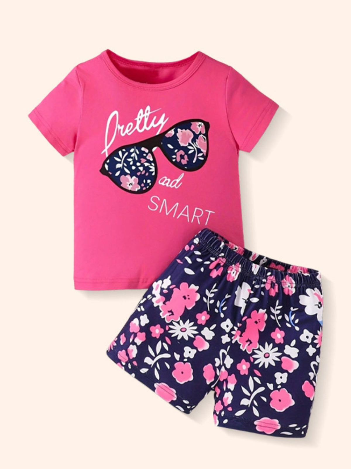 Pink graphic tee with sunglasses and floral shorts set for baby girls.