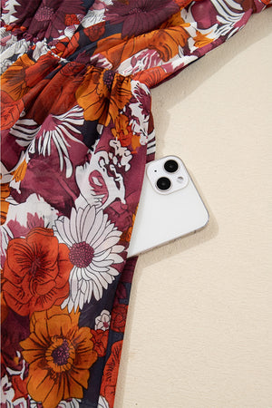 Floral wrap mini dress with puff sleeves and a cinched waist, featuring a bold floral print.