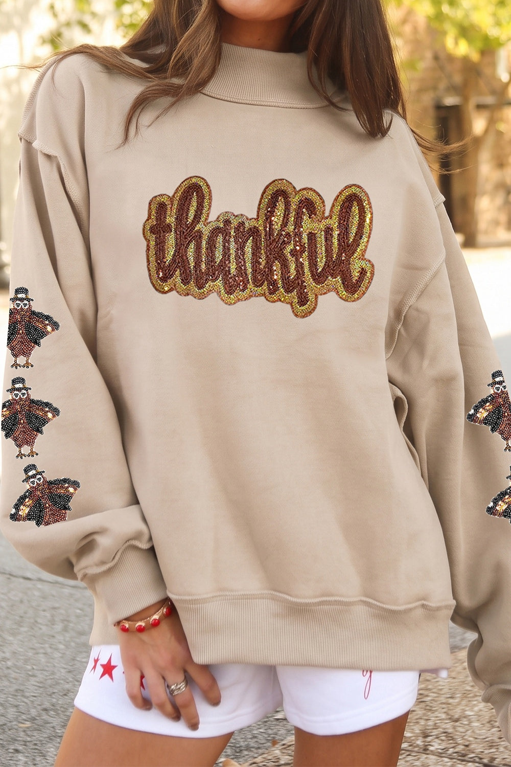 sweatshirt in beige featuring sequin embellishment and relaxed fit