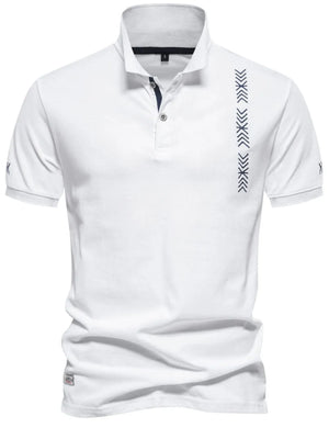 White piqué polo shirt with chevron embroidery detail on chest and short sleeves.