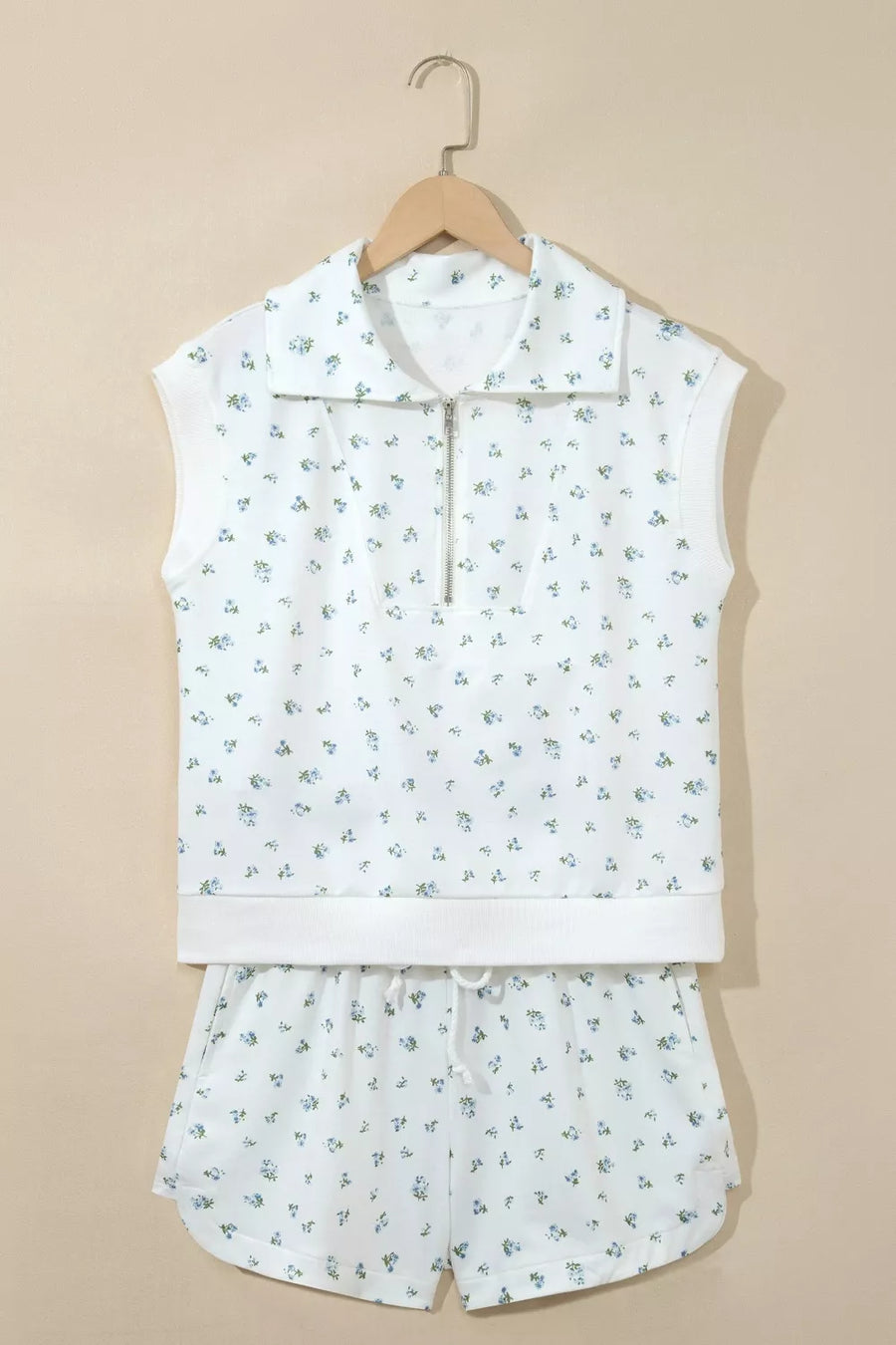 White floral print sleeveless zip-neck top and drawstring shorts set