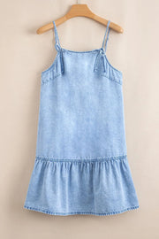 Light blue denim sundress with tie straps and ruffled hem.