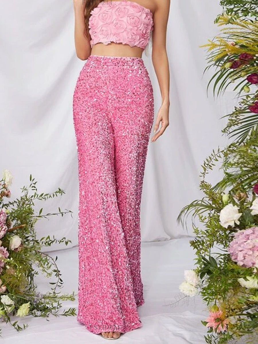Pink sequin wide leg pants with a high waist and flowy silhouette.
