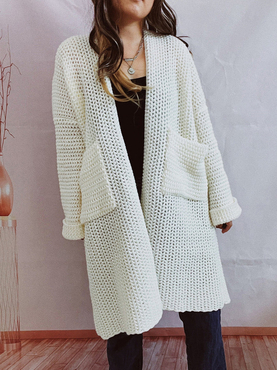 White chunky knit cocoon cardigan coat with pockets and rolled cuffs.
