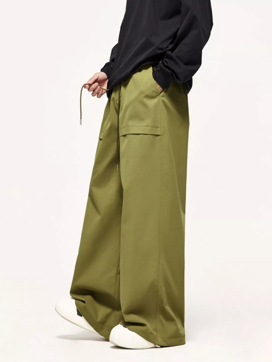 Relaxed fit cargo pants in yellow-green with drawstring and cargo pockets.