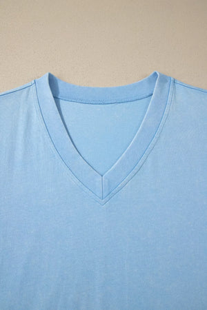 Light blue cotton v-neck top with relaxed fit and double-stitched neckline detail.