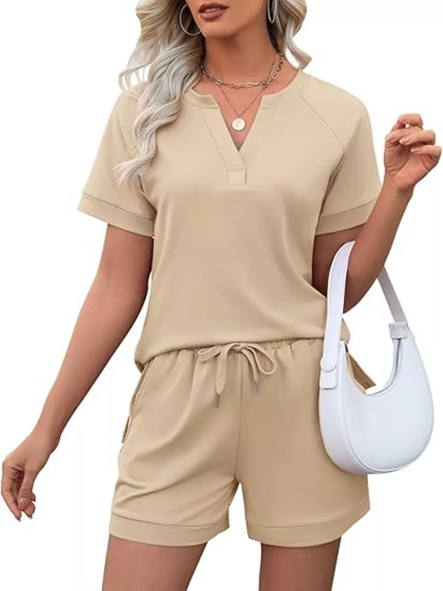 Apricot two-piece set with drawstring shorts and v-neck tee with pockets.