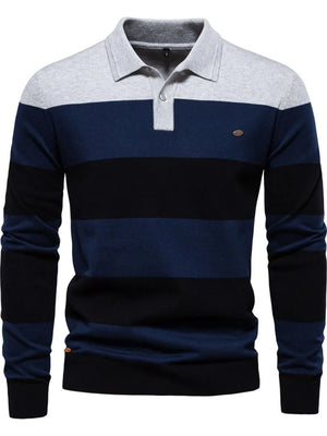 Colorblock knit polo with ribbed collar in navy, black, and grey stripes.