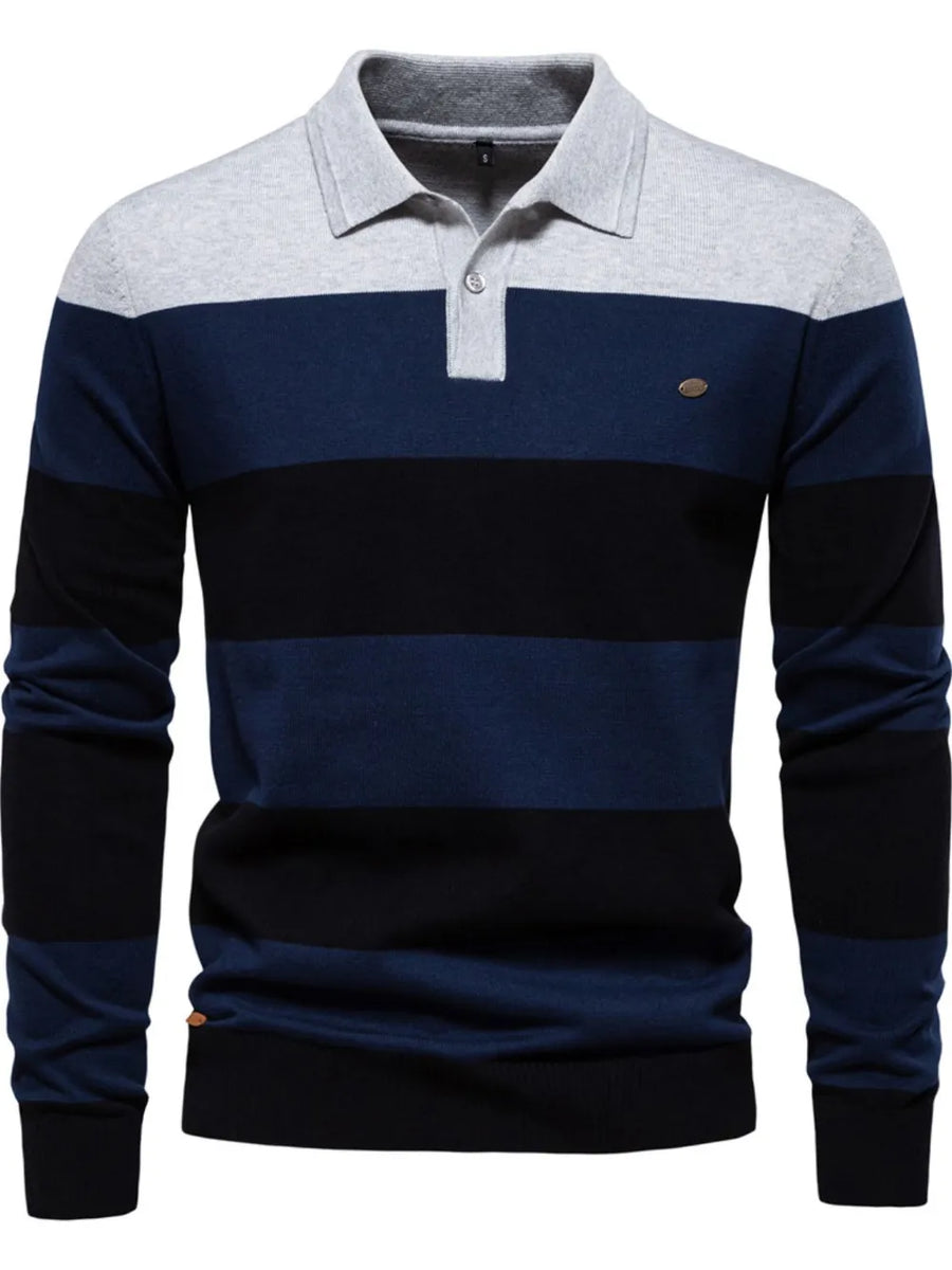 Colorblock knit polo with ribbed collar in navy, black, and grey stripes.