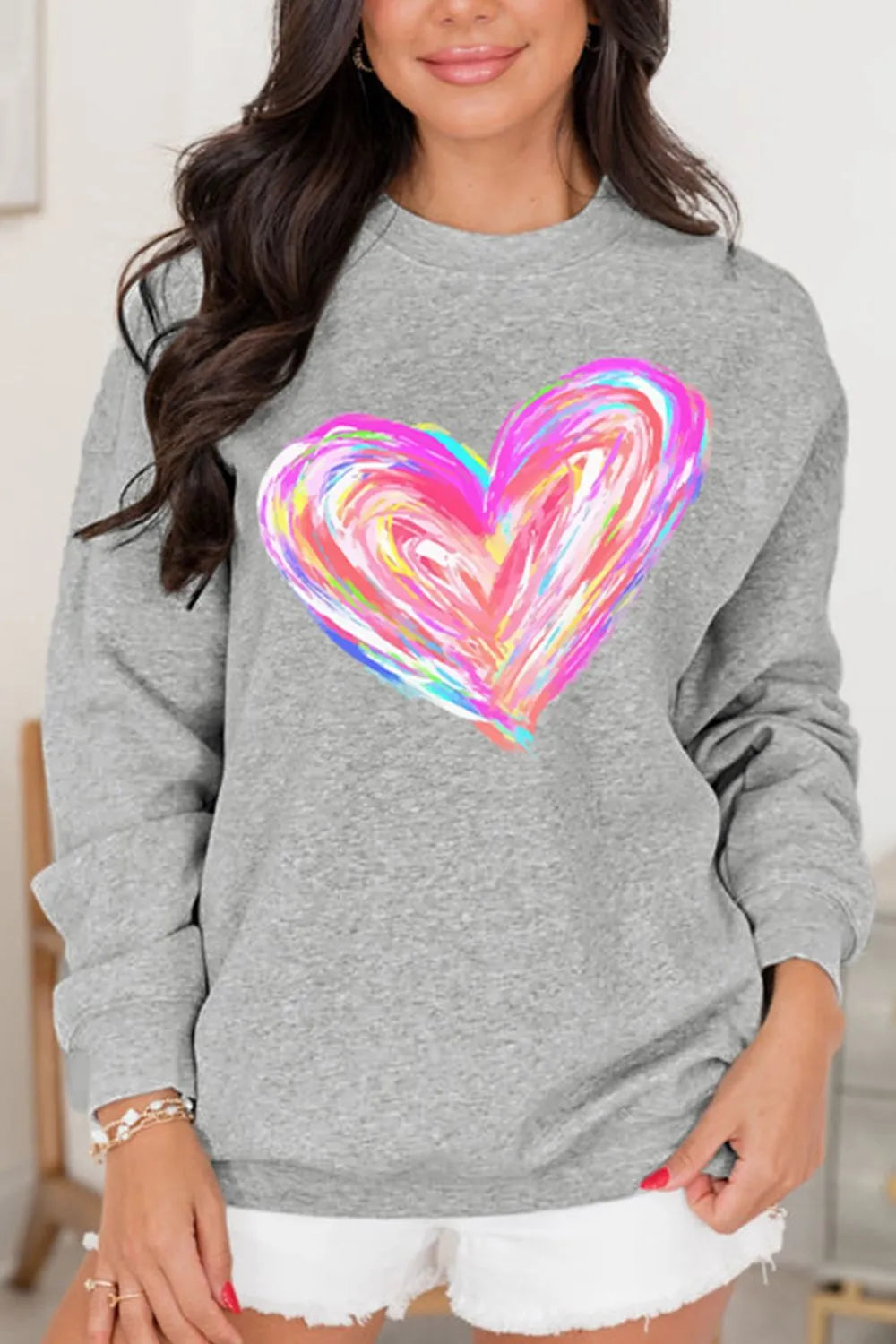 Gray crewneck sweatshirt with a colorful painted heart graphic.