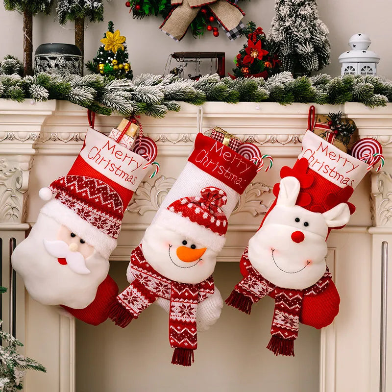 Three whimsical holiday character Christmas stockings: Santa, snowman, and reindeer, with Merry Christmas text.