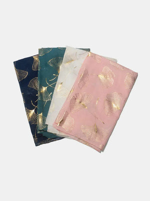 Gilded ginkgo leaf scarves in dark navy, green, white, and pink.