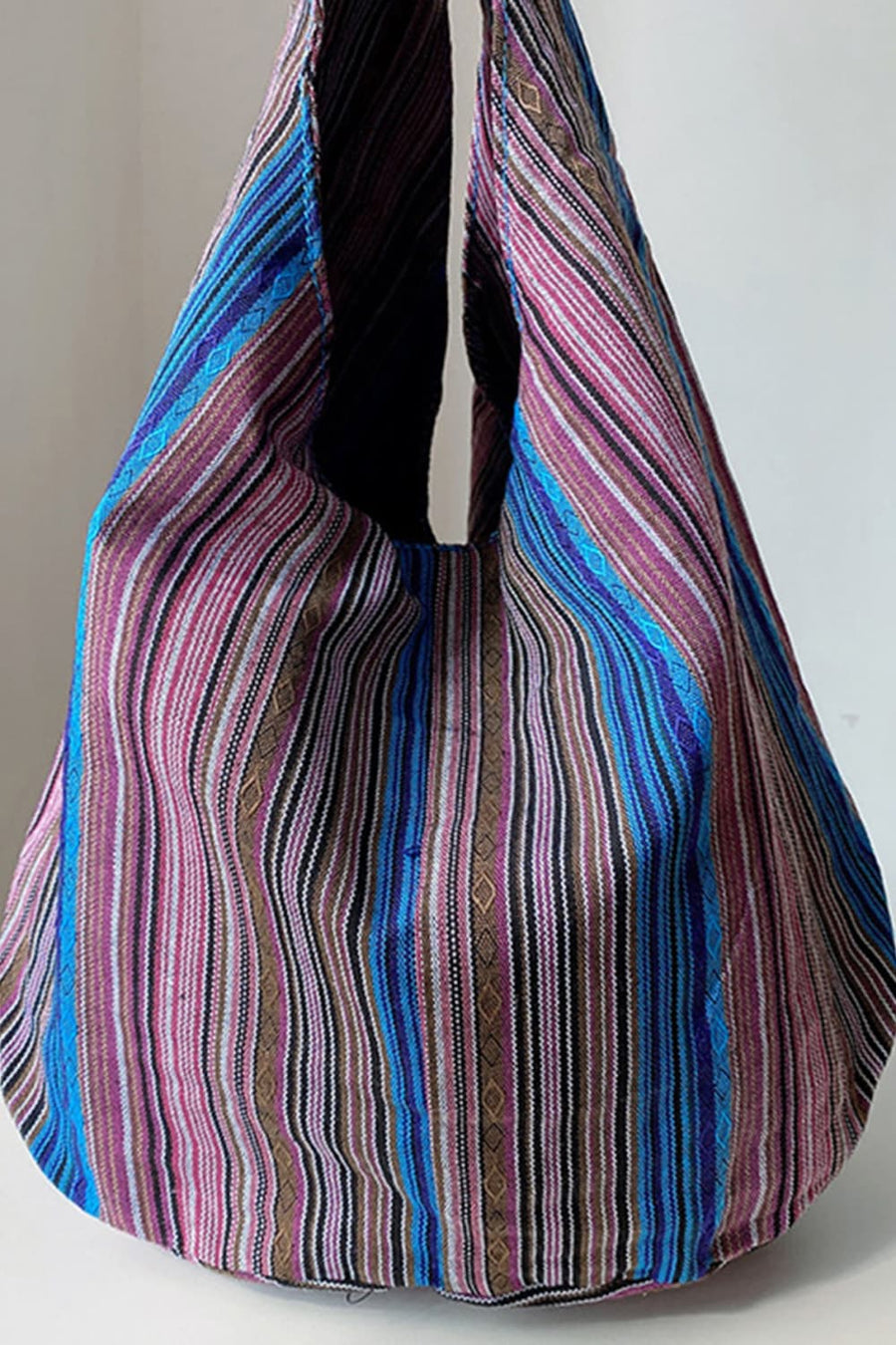 Tribal weave shoulder bag with multicolor stripes and diamond pattern detail