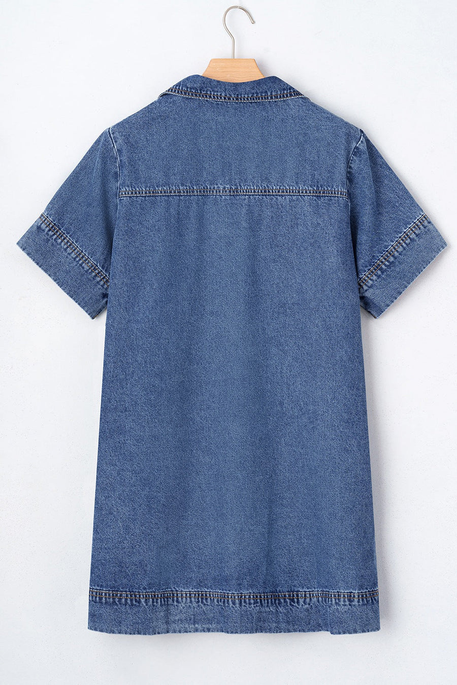 Light blue denim mini dress with short sleeves, collar, and contrast stitching details.