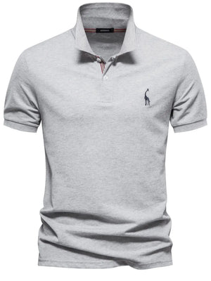 Gray piqué polo shirt with giraffe embroidery and striped collar detail.
