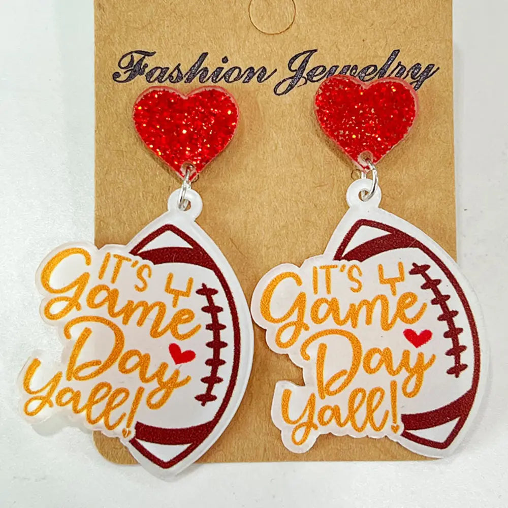 Game Day Acrylic Football Dangles with red glitter hearts and "It's Y'all" text.
