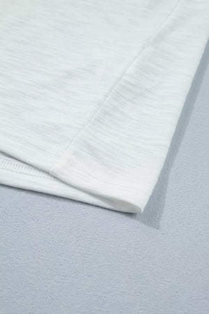 White polyester t-shirt with subtle heathered texture and ruffled detail.