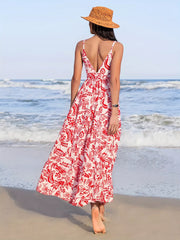 Red floral midi dress with a deep V-neck and spaghetti straps, a defined waist, and a flowy A-line skirt.