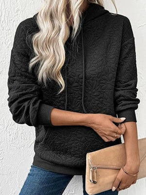 Black pullover hoodie featuring drawstring and floral
