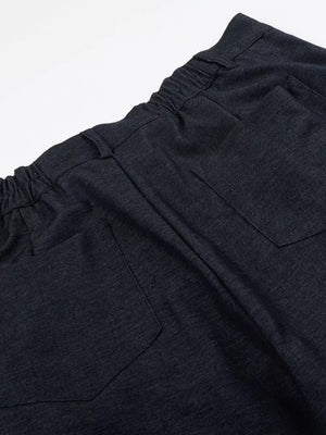 Relaxed fit sweatpants in dark heathered cationic fabric with adjustable waist and back pockets.