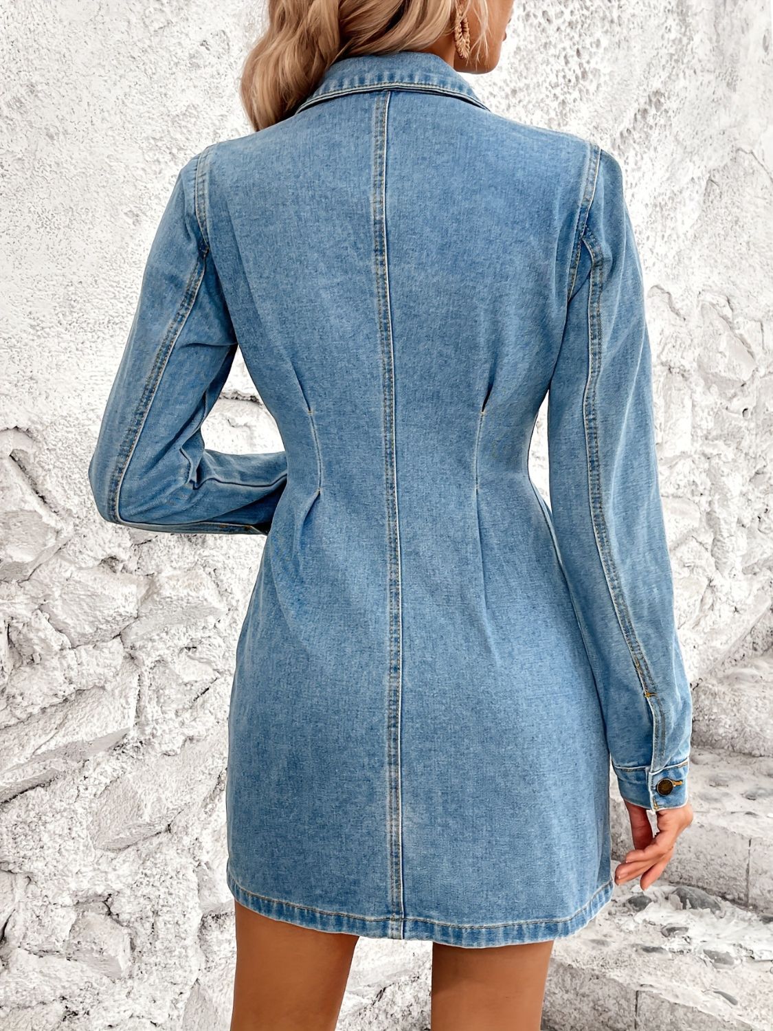 Sculpted denim button-down mini dress in medium wash cotton with long sleeves and a collared neckline.