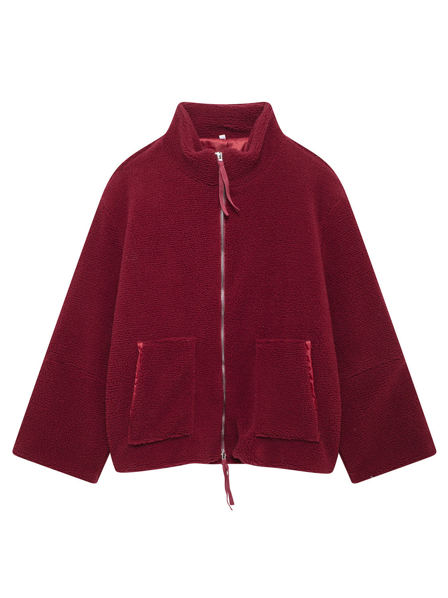 Burgundy sherpa stand-collar jacket with zip front and patch pockets.