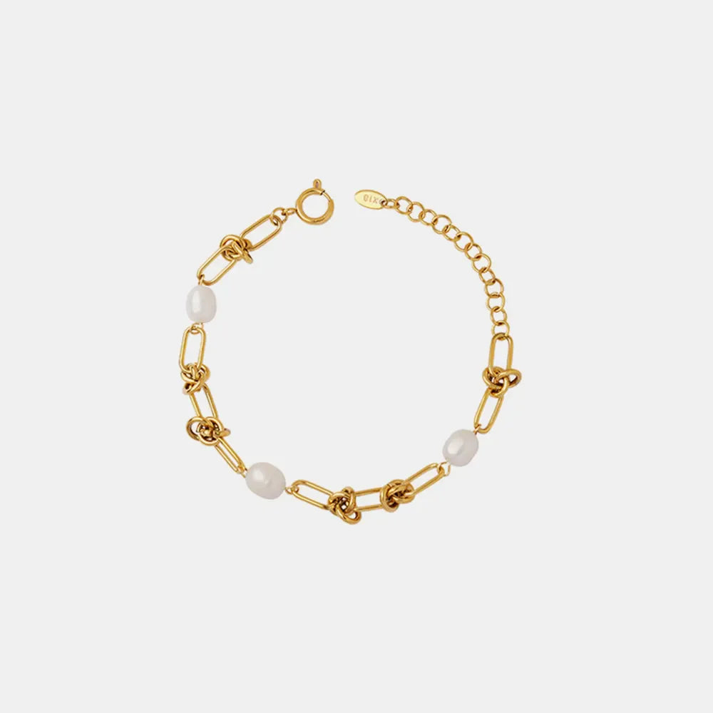 Gold knot and pearl link bracelet with adjustable chain closure