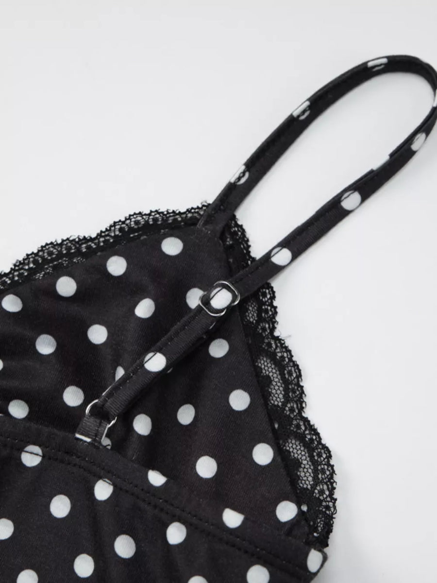 Black polka dot cami with white dots, lace trim, and adjustable straps.
