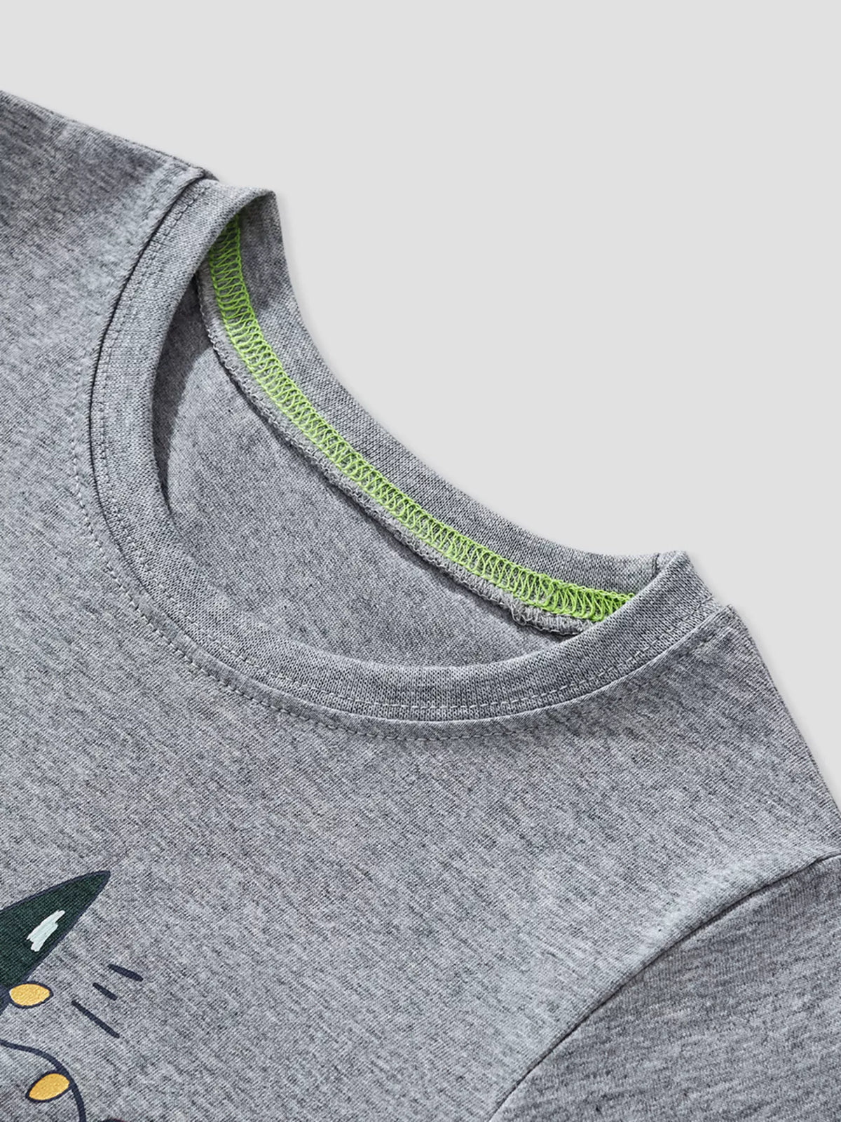 Gray cotton long-sleeve tee with dinosaur graphic and neon green neck trim detail.