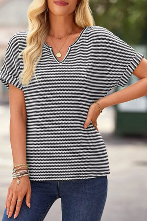 Textured knit t-shirt with black and white stripes, notched neckline, and short sleeves.