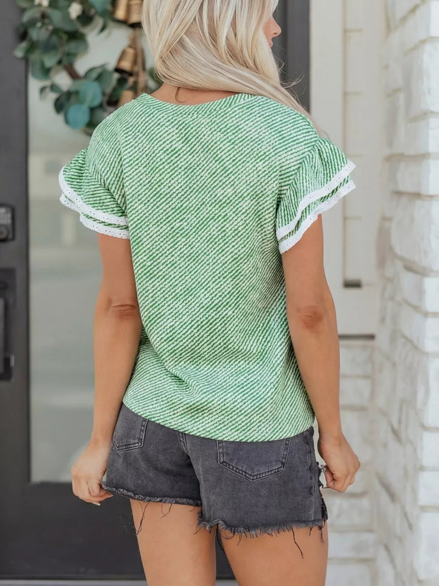 Women's green and white striped cotton blouse with ruffled sleeves and lace trim.