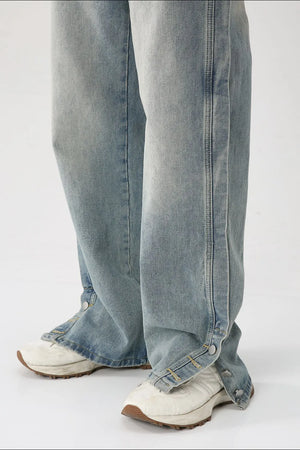 Baggy denim jeans in medium wash with side snap hem detail