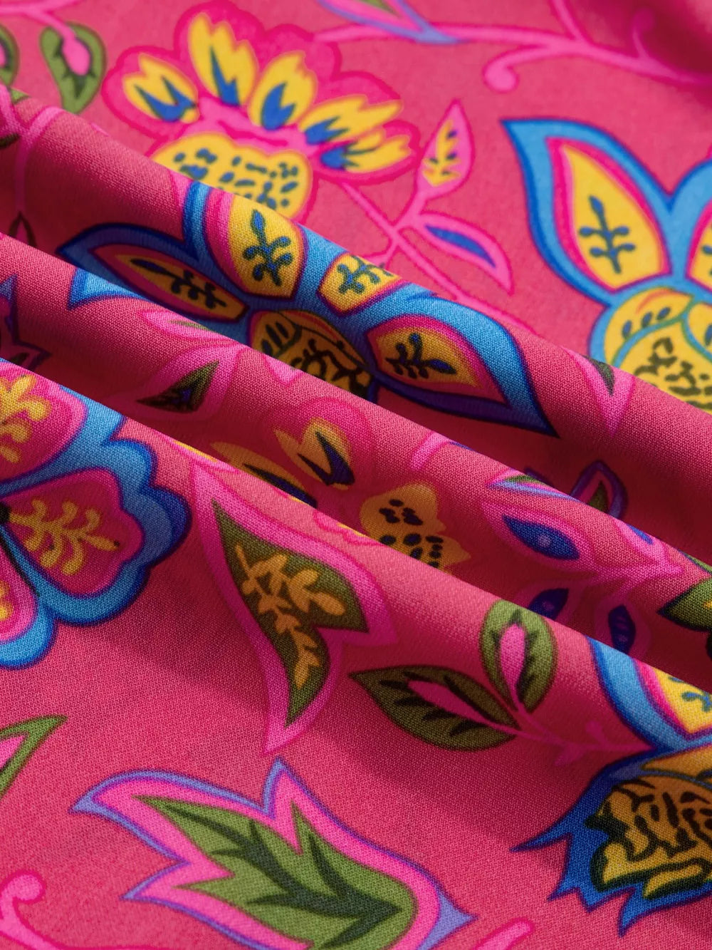 Floral midi dress in cotton blend with ruffled sleeves and vibrant print.