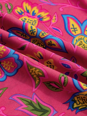 Floral midi dress in cotton blend with ruffled sleeves and vibrant print.