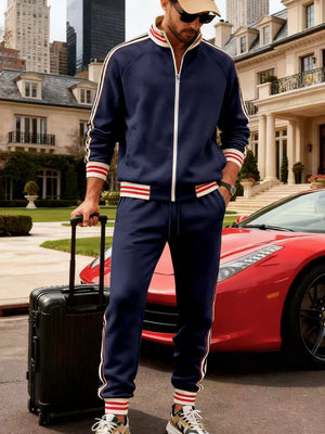 Navy blue tracksuit with white and red stripe accents on sleeves and legs.