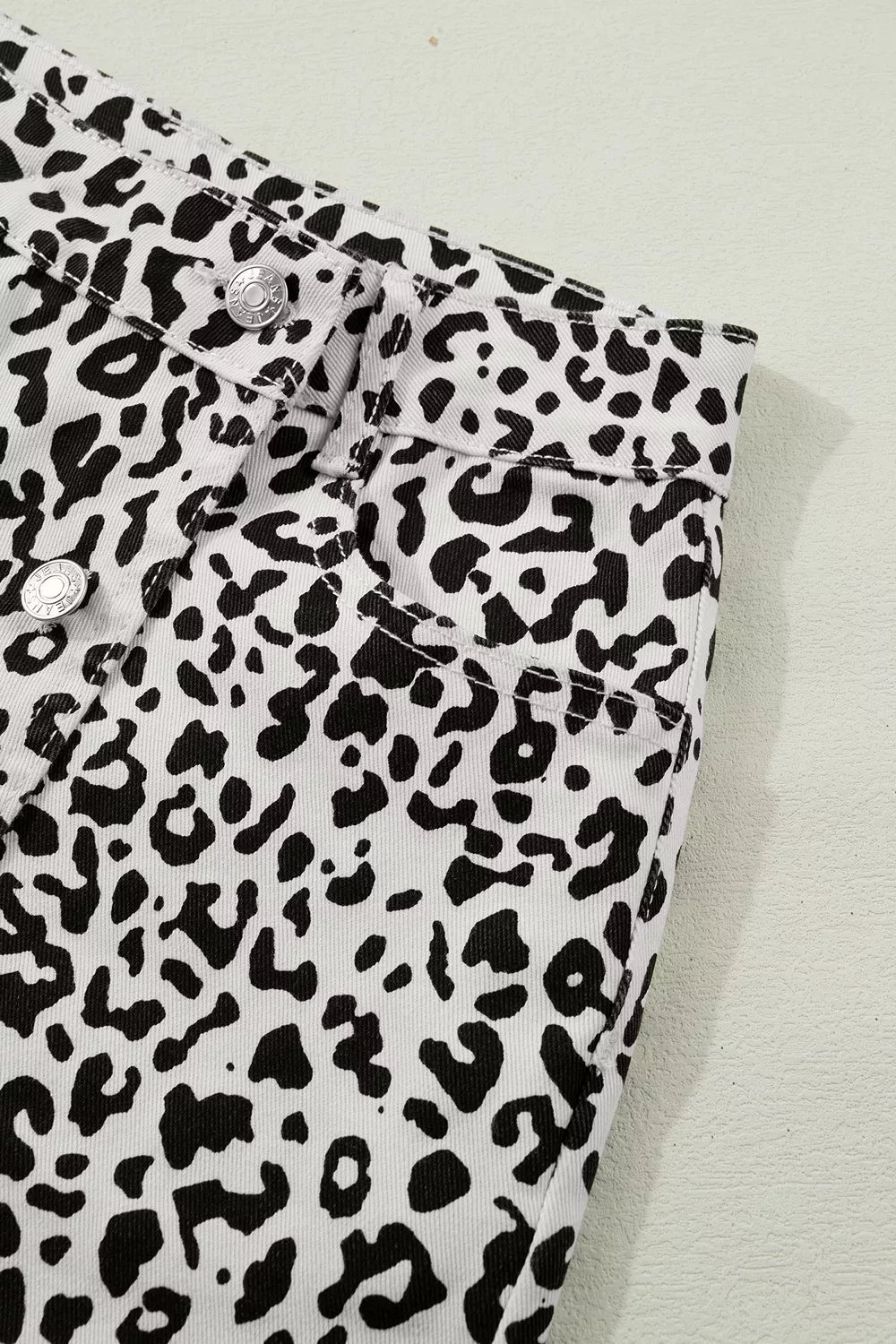 denim shorts featuring leopard-print in black with 56 texture