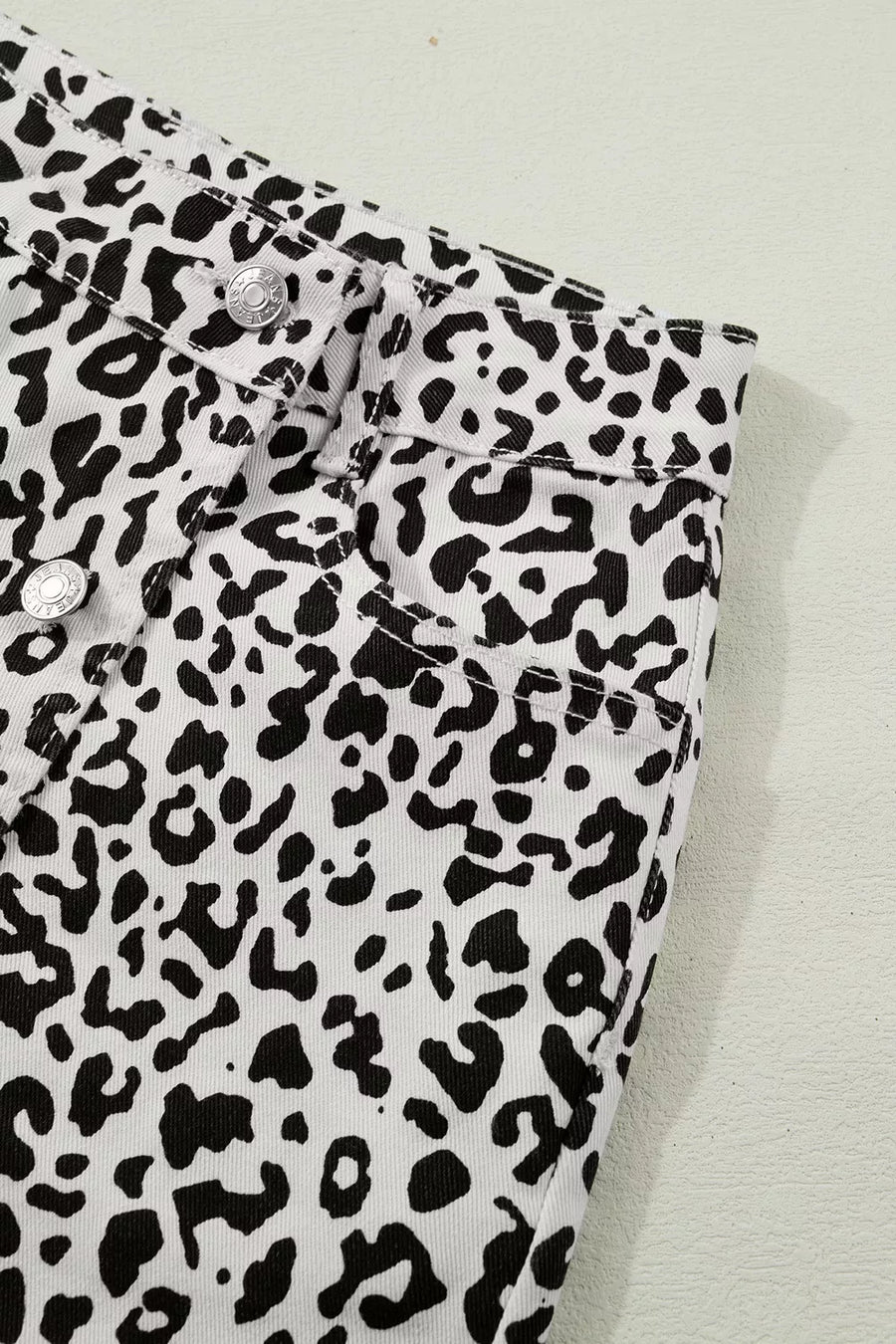 denim shorts featuring leopard-print in black with 56 texture