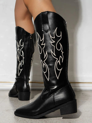 Black embroidered western knee boots with side zippers and block heels.