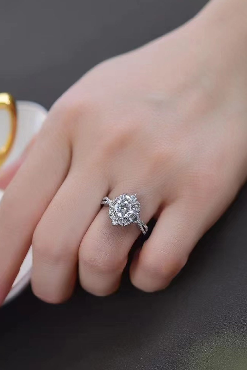 Silver floral halo twist ring with sparkling stones