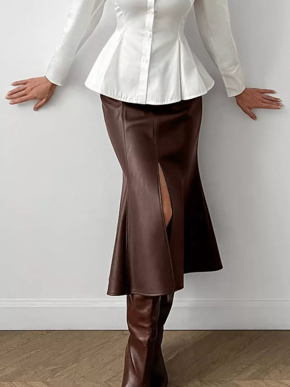 50% PU 47% Polyester 3% Spandex Care instructions: Machine wash cold midi skirt in Brown with flared silhouette
