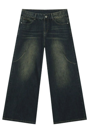 Faded wash palazzo jeans in dark denim with a wide leg and distressed details.