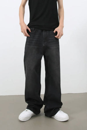 Black wide leg denim jeans with a relaxed fit and faded wash.
