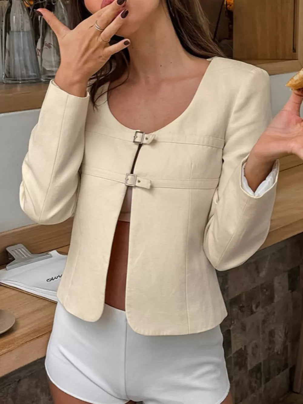 jacket in ivory featuring buckle closure and fitted fit