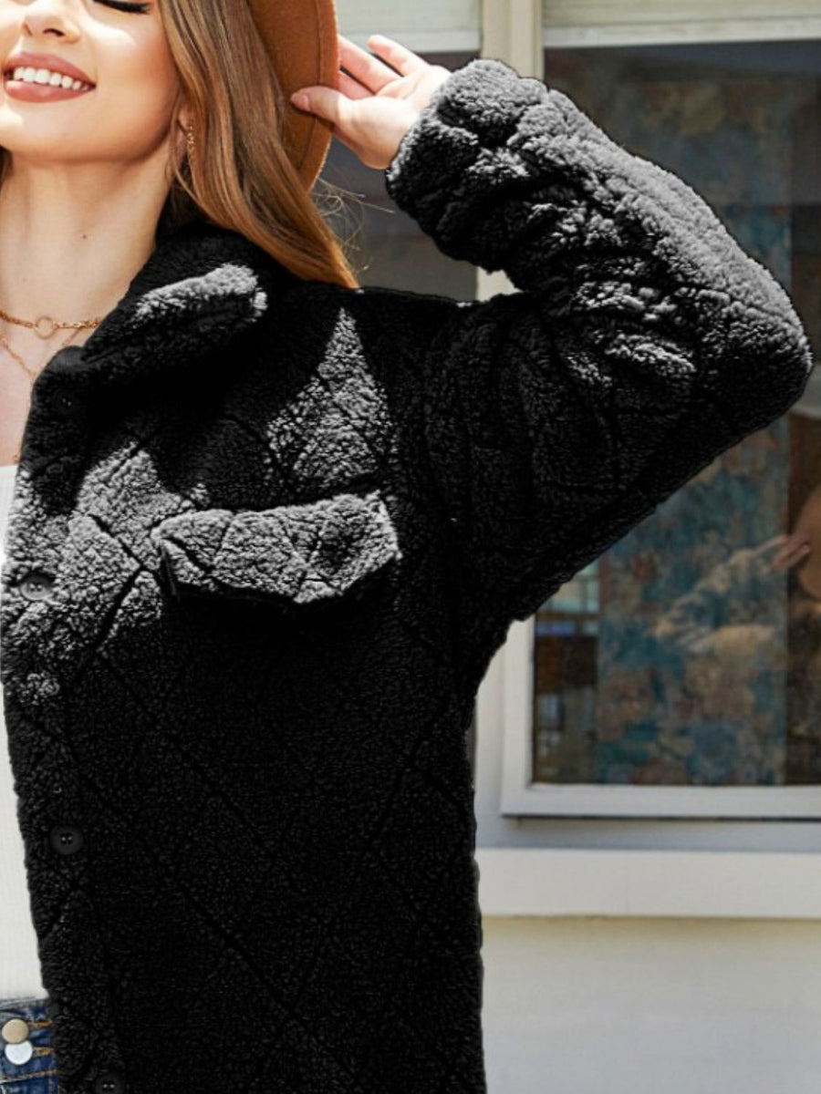 Black quilted teddy bear coat with patch pockets and button front.
