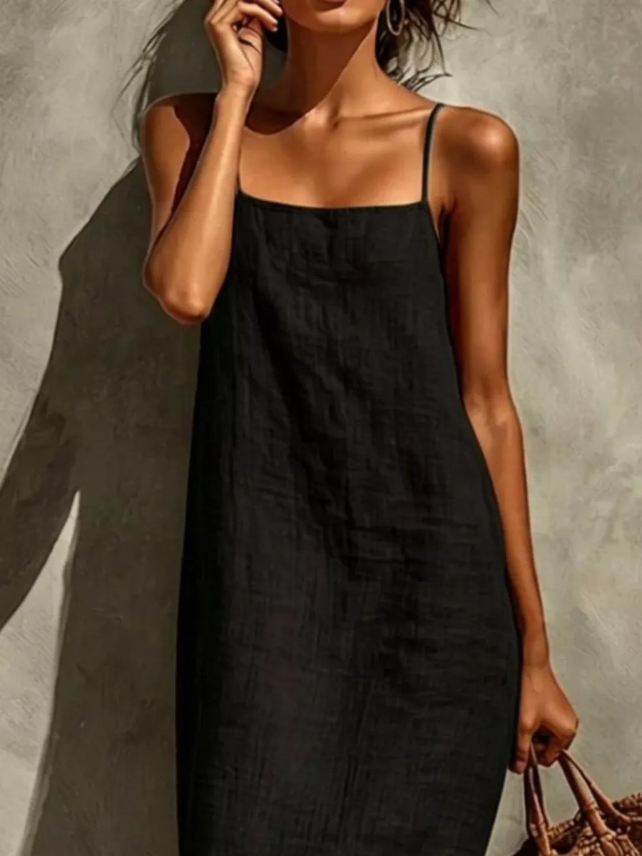 Black linen-blend maxi dress with spaghetti straps and square neckline.